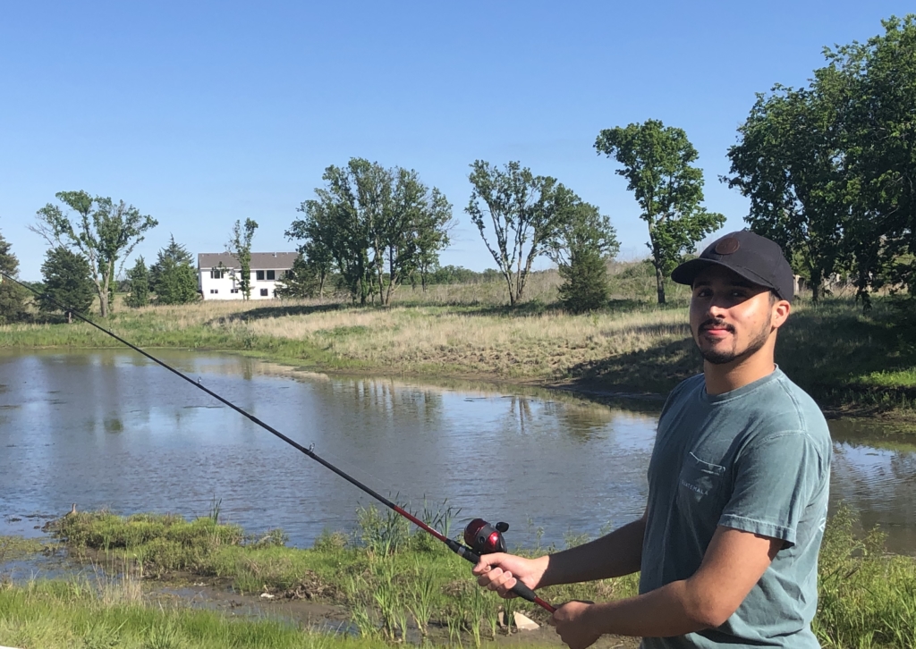 Jayden Levine, Sales Development Representative spending free time fishing by the lake.